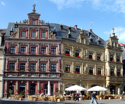 red and beige houses on square