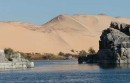 nile and desert from felucca * A view of the deep blue Nile, contrasting sharply with the golden sands of the dessert.  The rock formations are common along this part of the Nile, sometimes forming substantial islands. * 432 x 276 * (38KB)