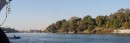 nile and shore aswan * A view of the Nile and its banks in the Aswan area.  Here there are trees lining the banks where their roots can reach the water.  But 50 feet beyond, it is nothing but sand. * 648 x 216 * (41KB)