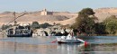 view mausoleum aga khan aswan * The young man in the row boat was rushing out to meet us as he wanted to sell us his wares.  A view of the Mausoleum of Aga Khan is in the background.l * 432 x 201 * (44KB)