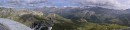 panorama south-east * A panoramic view of the mountains south and east of the Edelweiss Spitz.  The road at the very right of the photo is the road to the Grossglockener Pass, approaching from the north. * 720 x 169 * (57KB)