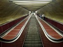 metro escalator * A shot from the bottom of one of the huge escalators in the Prague metro system.  This and others like it are long and quite steep.  While traveling on it, people look as if they are leaning back (if moving down) or leaning forward (if moving up) because the angle is so great. * 432 x 324 * (77KB)