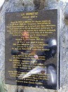 col de la bonette sign * This sign gives the history of this route, beginning with Napoleon in 1860 as he travelled north from Nice to Briancon, later used by the military for national defence, and finally the last portion to the very top completed in 1961.  Jim and his bike appear in the reflection. * 323 x 432 * (62KB)