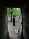 jim from inside bunker * Jim outside, with Verna inside the remains of one of the bunkers.  The photo shows the narrowness of the corriders. * 324 x 432 * (47KB)